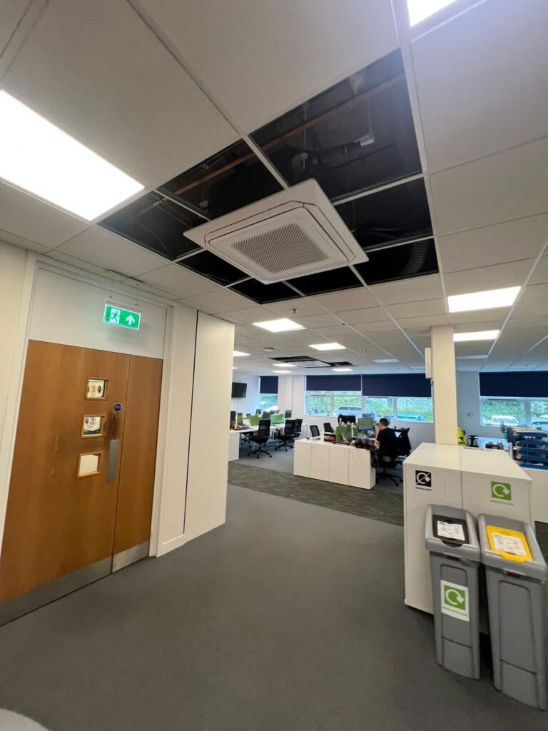 Engineer assessing the best AC for commercial use in an office building