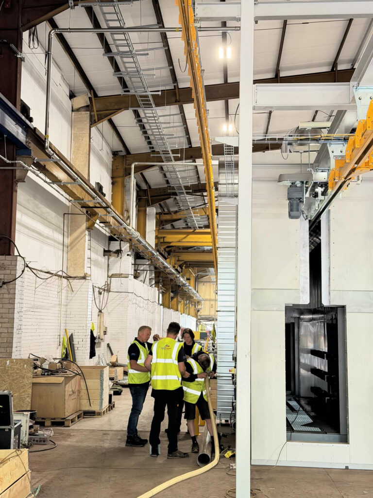 Engineers completing a commercial gas line installation for R. Tindalls Fabricators Ltd inside the warehouse