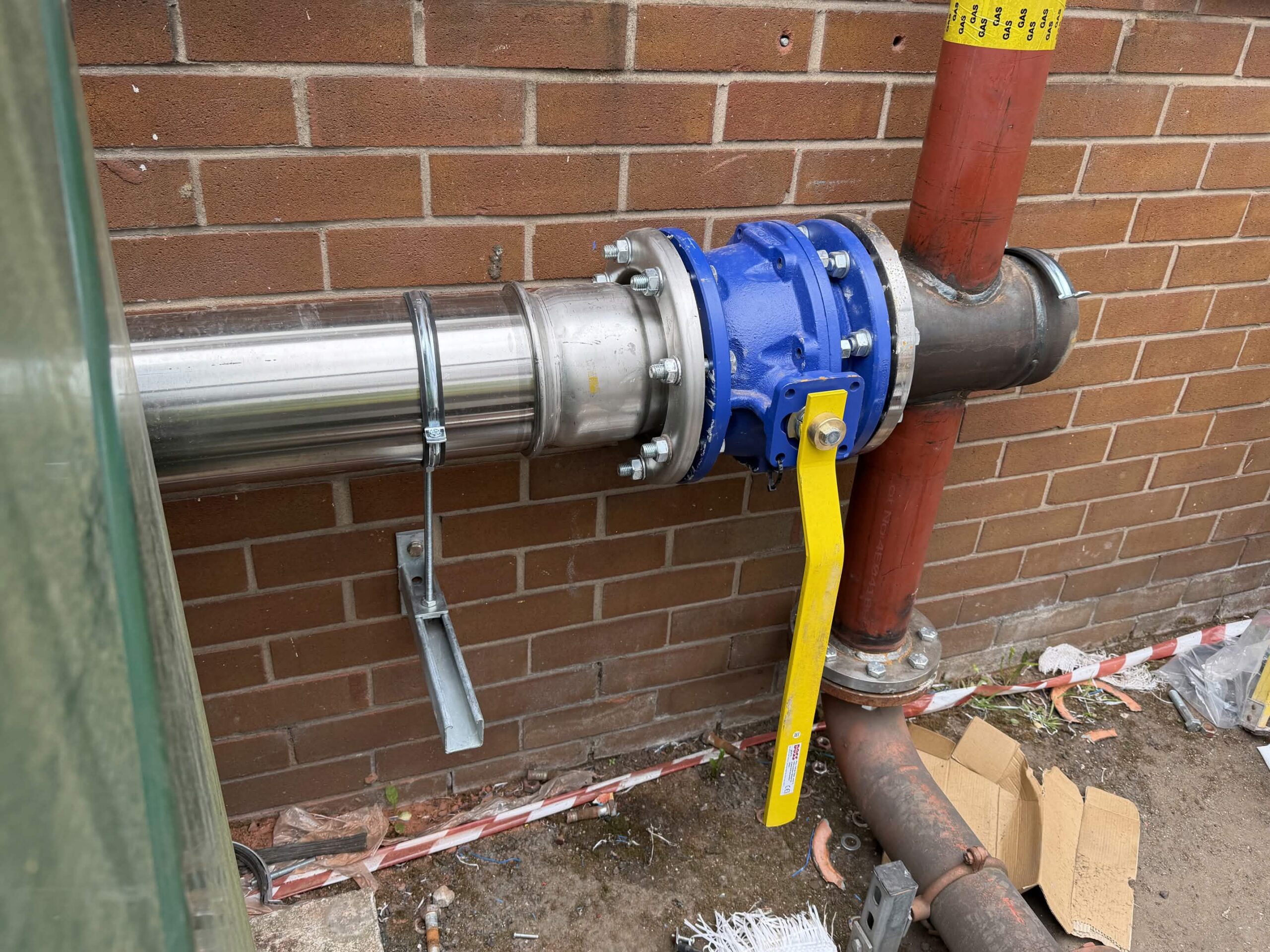 New gas supply valve and flanged connection installed on the external gas line at R. Tindalls Fabricators Ltd