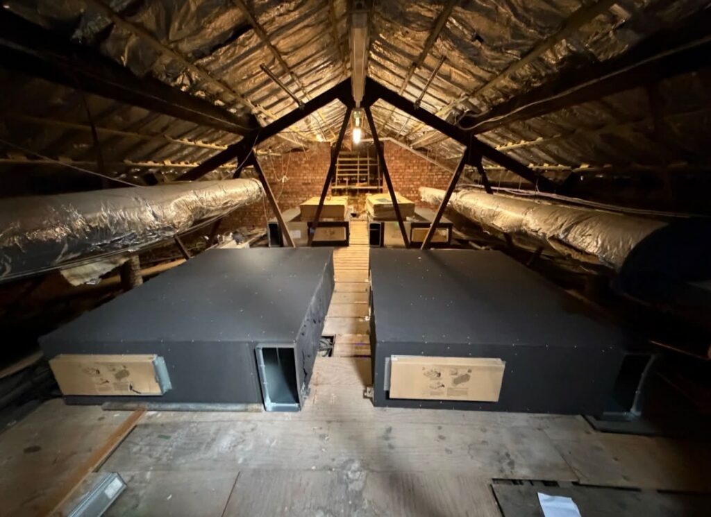 Four large Mitsubishi Lossnay MVHR units installed in the roof void of Altrincham Garrick Playhouse